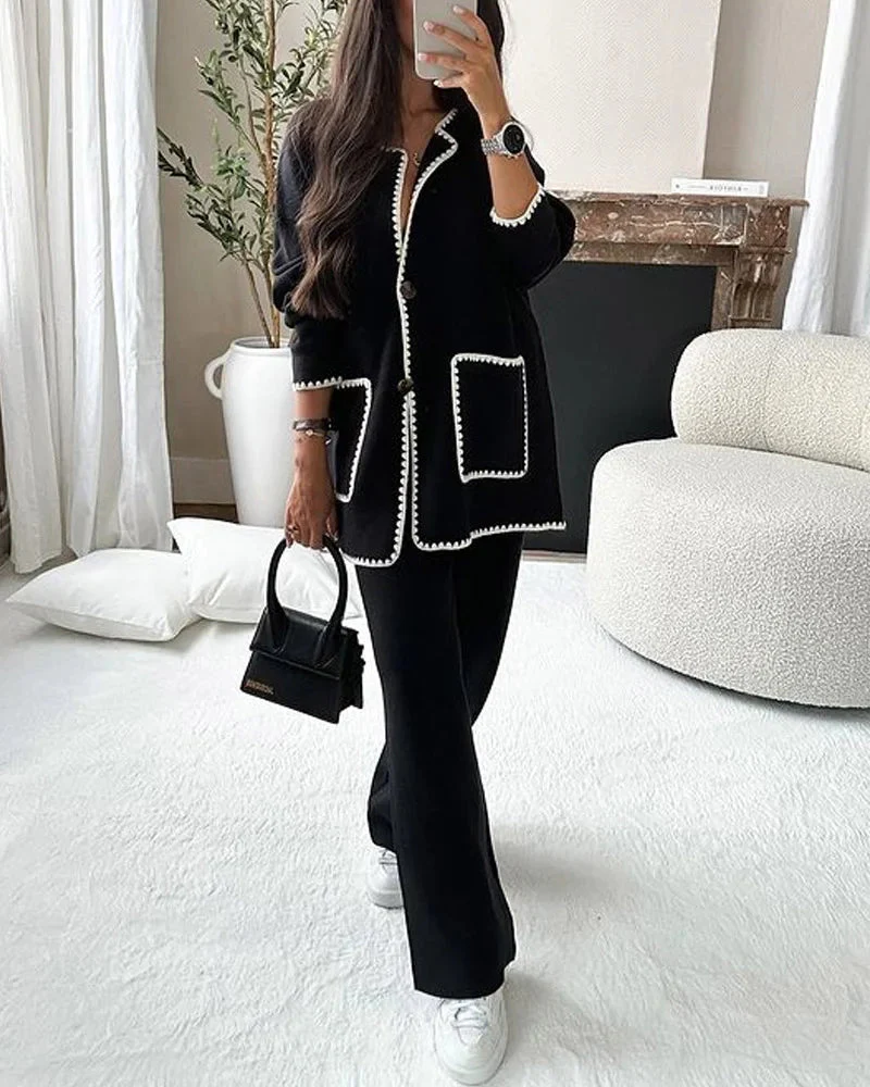 Conjunto de dos piezas compuesto por una chamarra decorada con líneas y un pantalón informal - Image 3