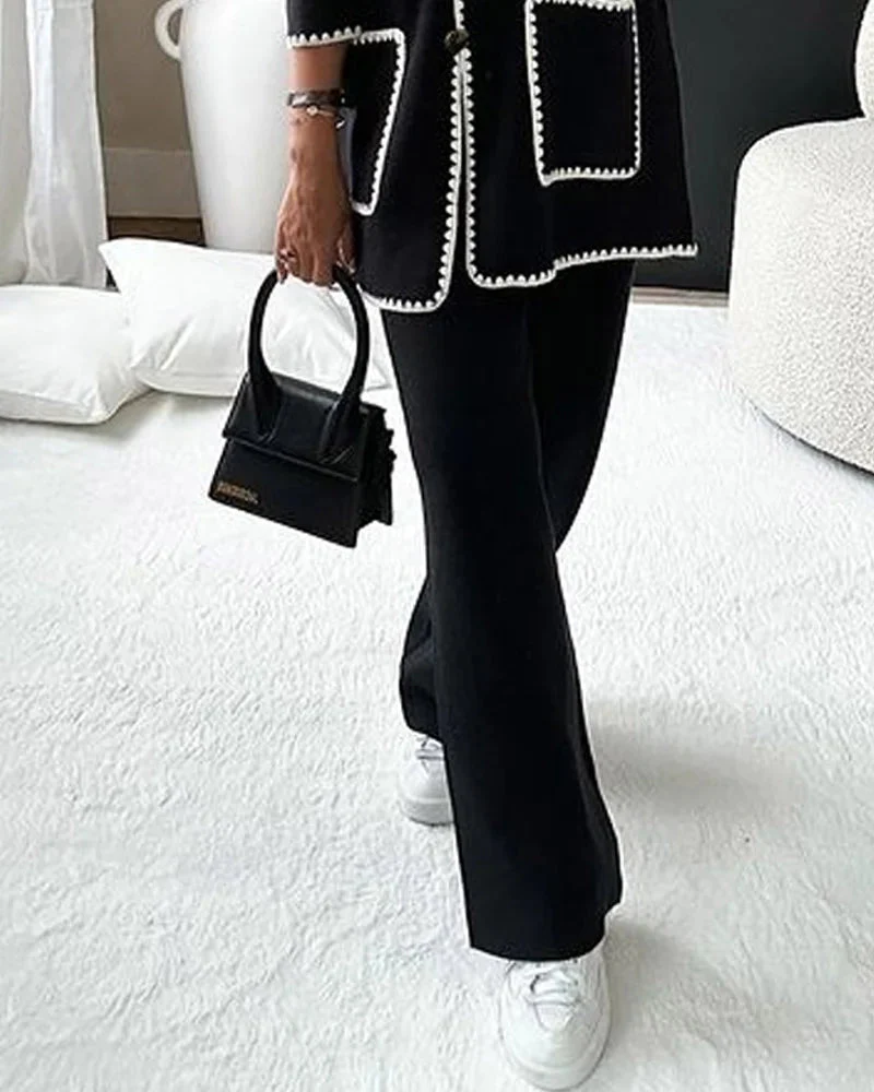 Conjunto de dos piezas compuesto por una chamarra decorada con líneas y un pantalón informal - Image 6